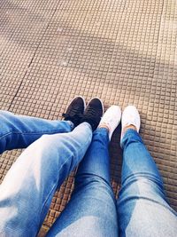 Low section of man wearing shoes