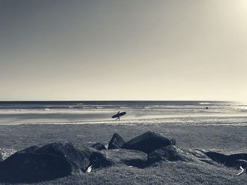 Scenic view of beach against clear sky