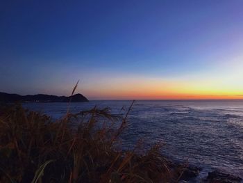 Scenic view of sea against sky during sunset