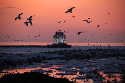 Scenic view of sea against sky during sunset lighthouse 