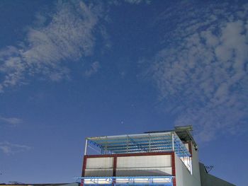 Low angle view of building against blue sky