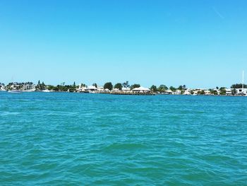 View of sea against clear blue sky