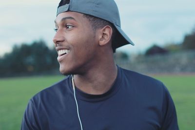 Smiling young man looking away