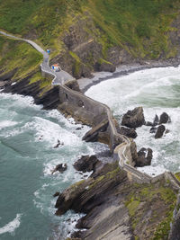 Aerial view of wall by sea