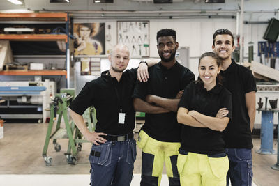 Portrait of confident high school students with teacher in training class