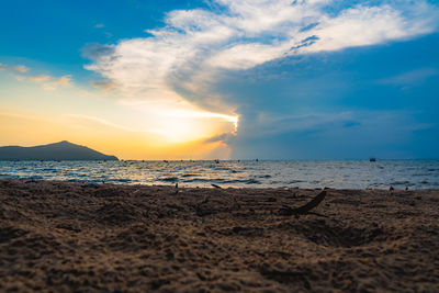 Scenic view of beach against sky during sunset