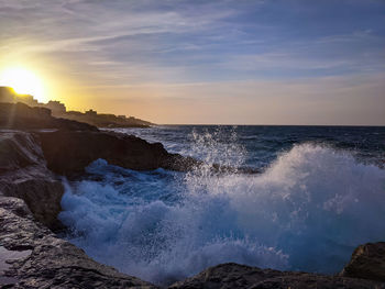 Scenic view of sea against sky during sunset