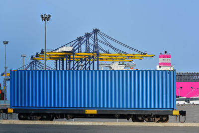 Built structure on pier against clear blue sky