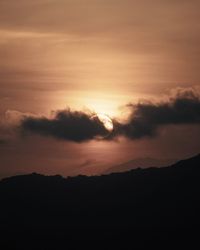 Low angle view of silhouette landscape against sky during sunset