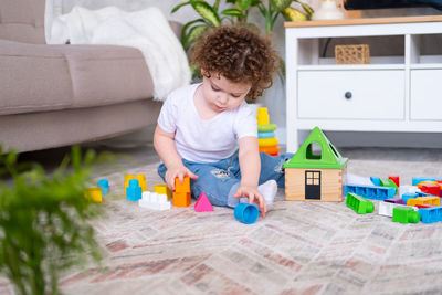 Boy playing with toy car