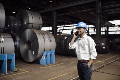 Full length of man standing in factory