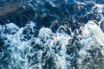 High angle view of water splashing in sea