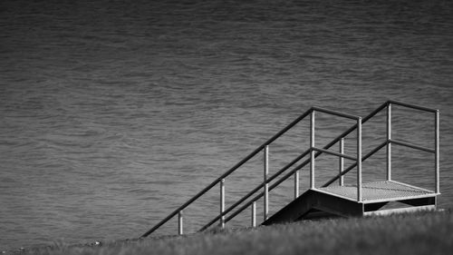 High angle view of staircase by sea