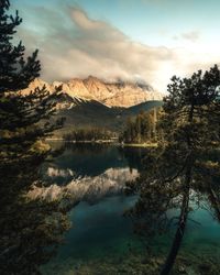 Scenic view of lake and mountains against sky