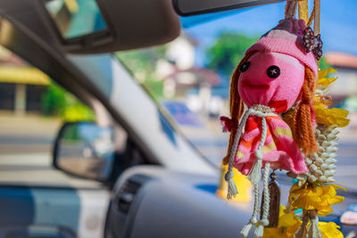 Close-up of decoration hanging in car