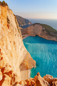 Scenic view of rocks and sea against sky