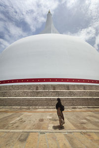 Rear view of a woman walking in temple