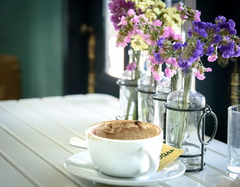 Close-up of coffee cup on table