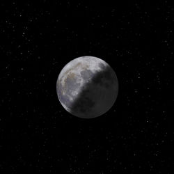 Low angle view of moon against sky at night