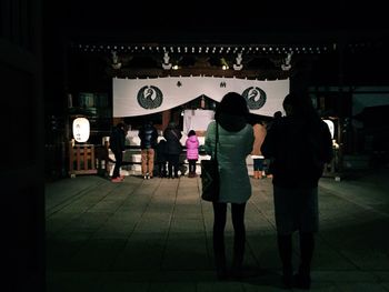 Full length of woman standing at night