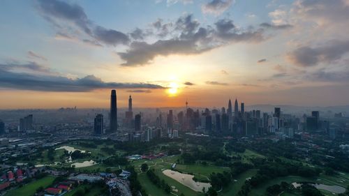 Panoramic view of city against sky during sunset