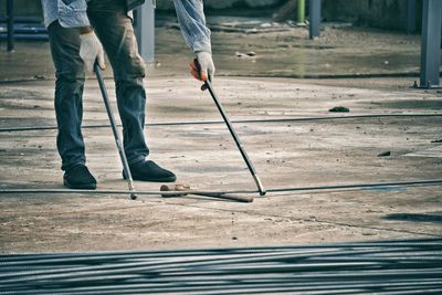 Low section of man working at construction site