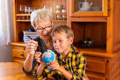 Portrait of boy playing with toys at home