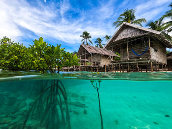 View of swimming pool by building against sky