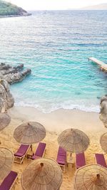 High angle view of chairs on beach