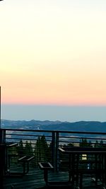 Scenic view of mountains against clear sky during sunset