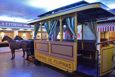 View of empty chairs and tables at railroad station