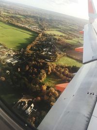 Aerial view of airplane wing over landscape