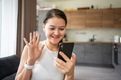 Young woman using mobile phone