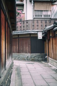 Empty alley amidst buildings in city