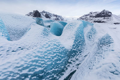 Scenic view of snowcapped landscape against sky