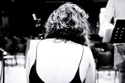 Rear view of woman sitting in restaurant