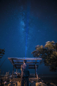 High angle view of illuminated building against sky at night