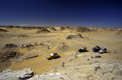 High angle view of land vehicles on desert landscape