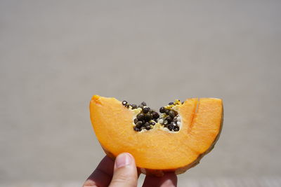 Close-up of hand holding fruit