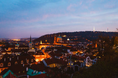 Prague, czechia - a magical view of the illuminated streets of the capital and its brown rooftops.