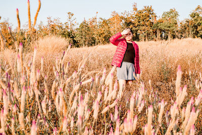 Full length of woman standing on field