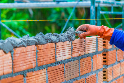 Close-up of man working on metal