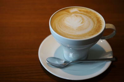 Close-up of cappuccino on table