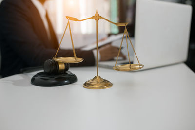 Close-up of clock on table