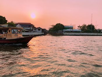 Scenic view of sea against orange sky