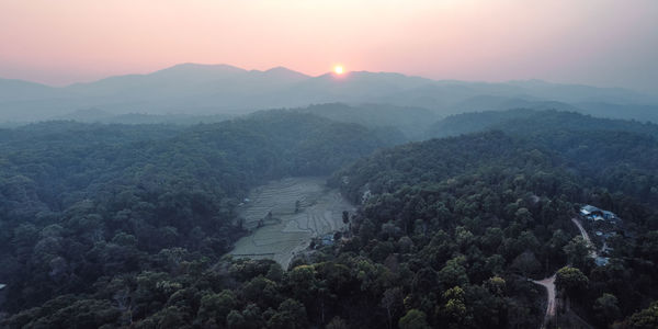 High angle view of mountains against sky during sunset