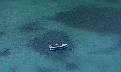 High angle view of boat sailing on sea