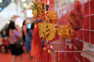 Close-up of decorated hanging at market stall