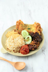 High angle view of food in plate on table