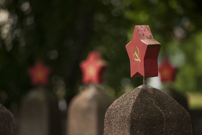 Close-up of stone cross in cemetery